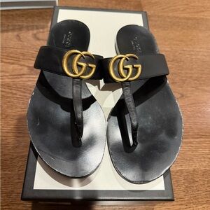 Gucci Black Thong Sandals with Gold Emblem
